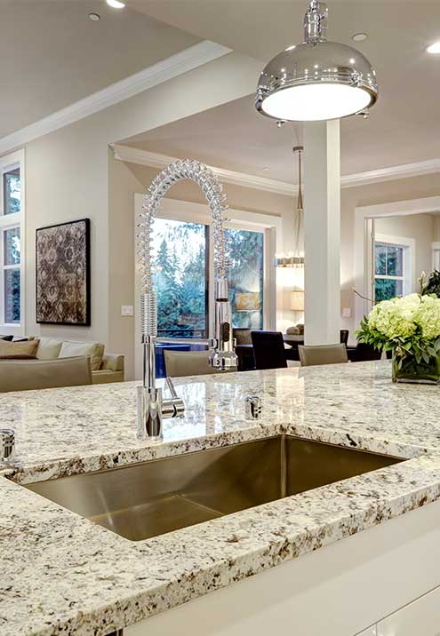 Granite kitchen island countertop with undermount sink by Mayan Stonecrafters in Melbourne, FL